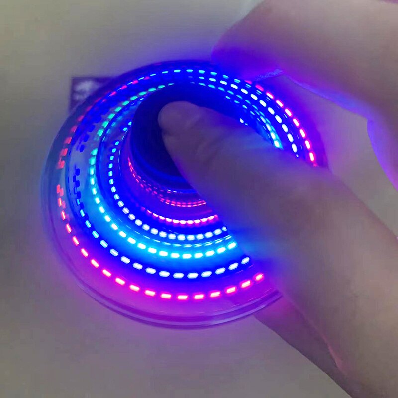 Flynova Mini UFO Spinner with LED lights glowing mid-flight